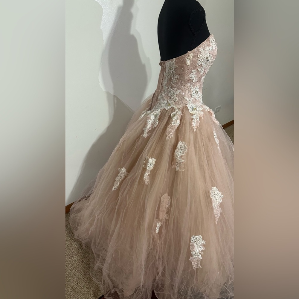 Worn once, does have a small stain. Needs to be washed and steamed.